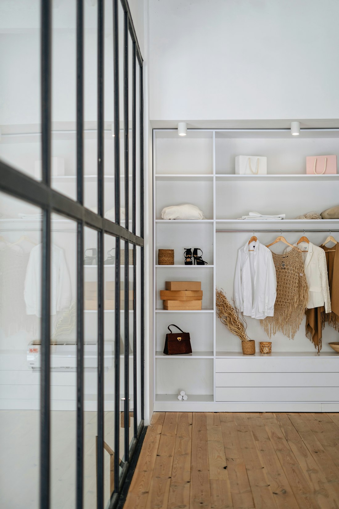 Open shelving with garments sorted by category