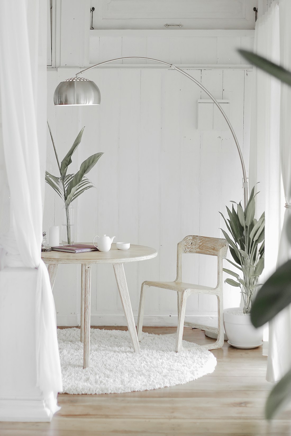 Corner of a home with natural light and restrained furnishings